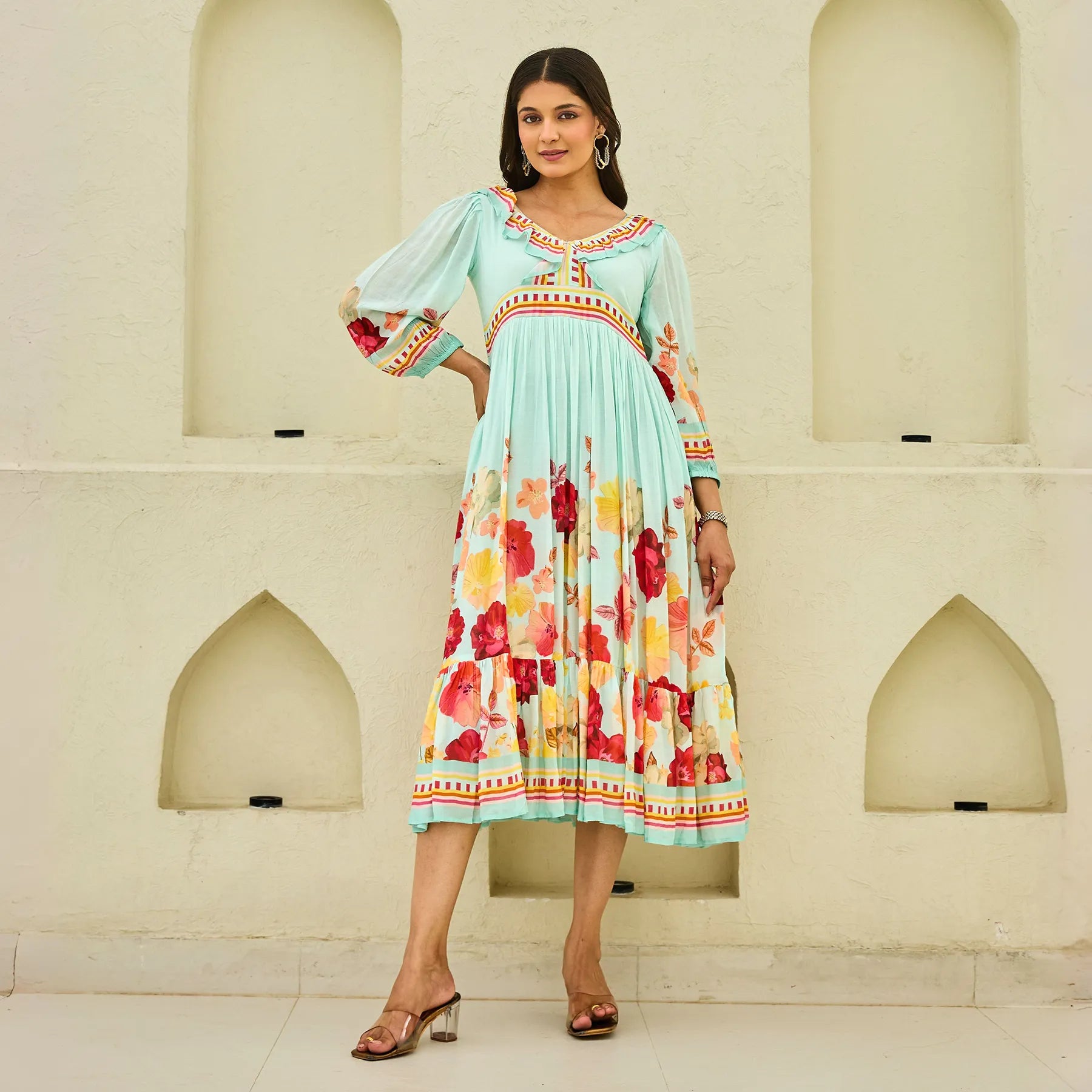 Model wearing a floral midi dress for women with 3/4 puff sleeves, standing front-facing — perfect for brunches and weekend outings