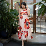 Floral summer dress with sleeveless cut and one-shoulder ruffle, a chic option for beach and vacation style.