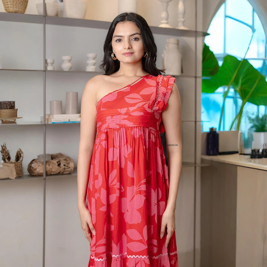Close-up of vibrant floral midi dress for women, highlighting the one-shoulder neckline and soft summer fabric.