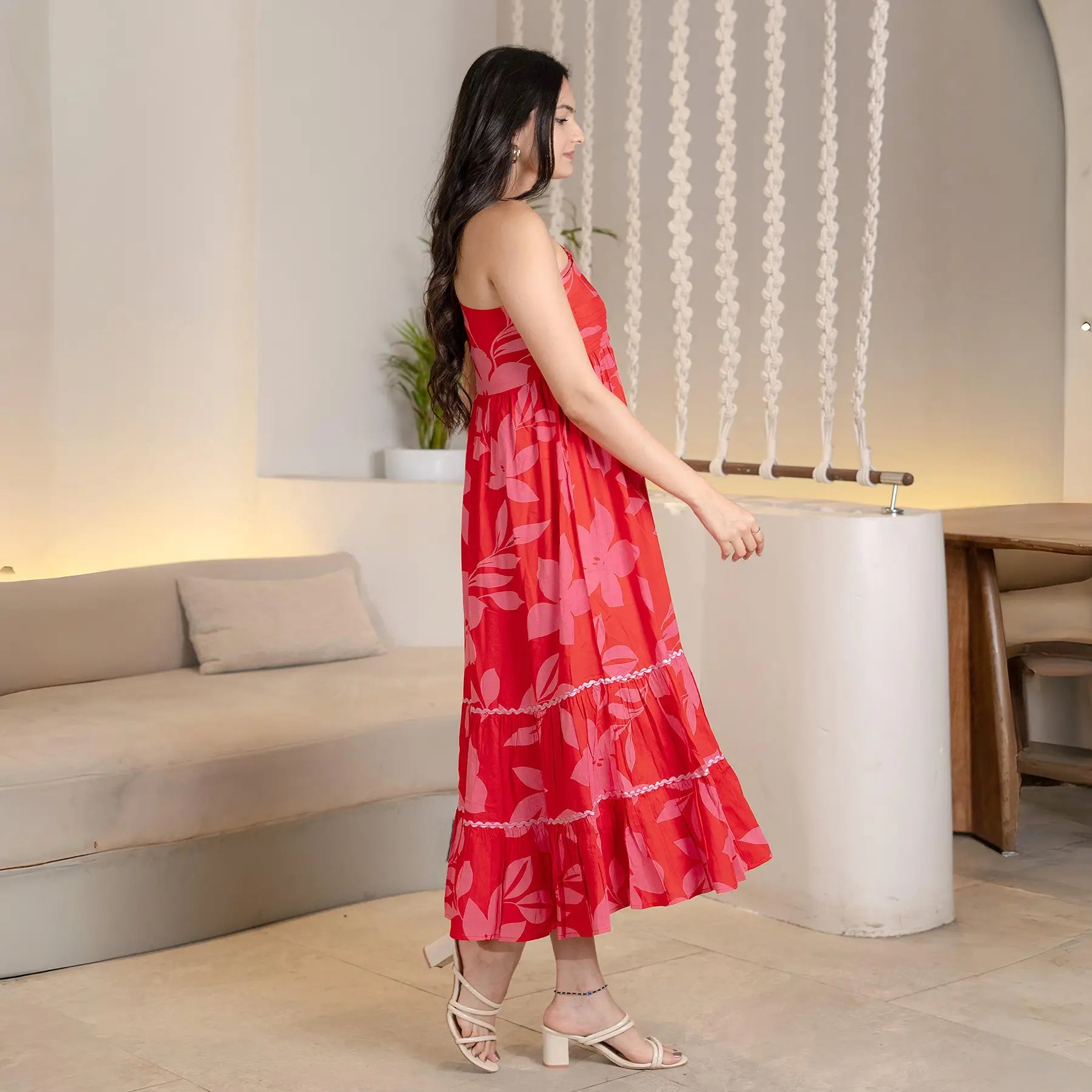 Side view of red floral midi dress for women, showing the flowing A-line silhouette ideal for casual gatherings.