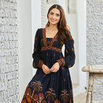 Close-up of neckline and floral print – black one piece viscose midi dress for women.