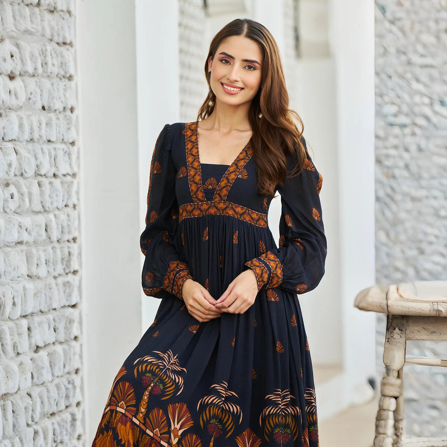Close-up of neckline and floral print – black one piece viscose midi dress for women.