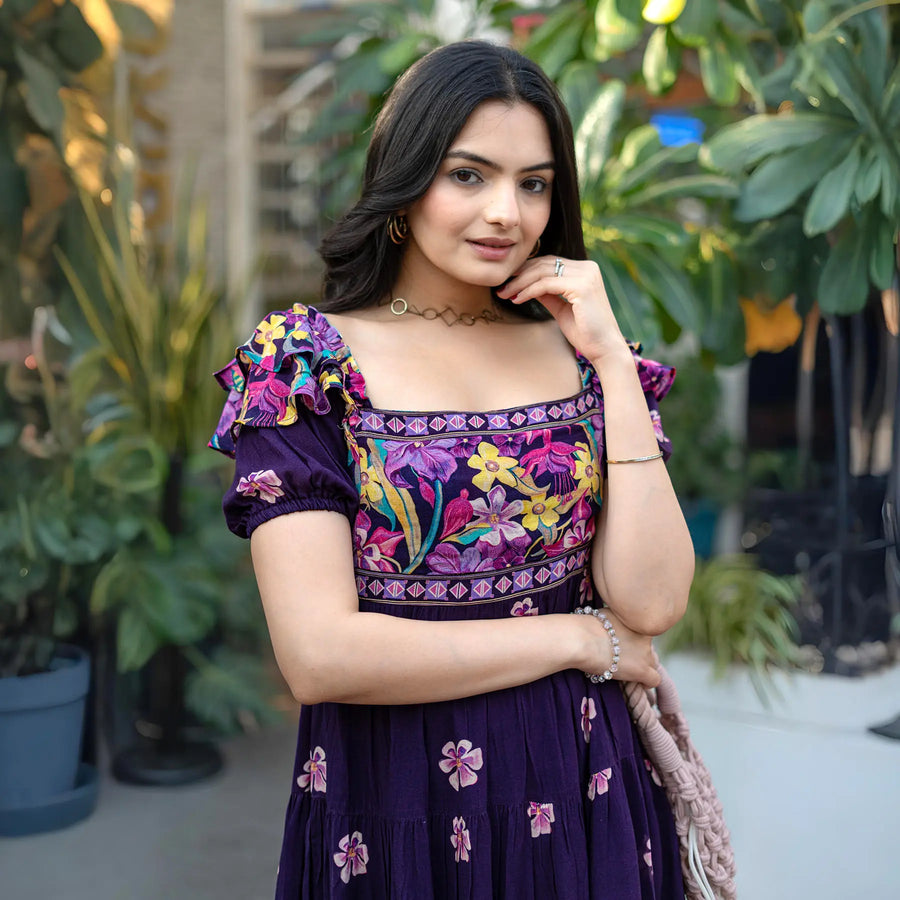 Close-up detail of neckline and embroidery in a colorful summer frock for women.