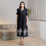 Noir Bloom black cotton maxi dress with white embroidery, a flared style perfect for festive or casual days
