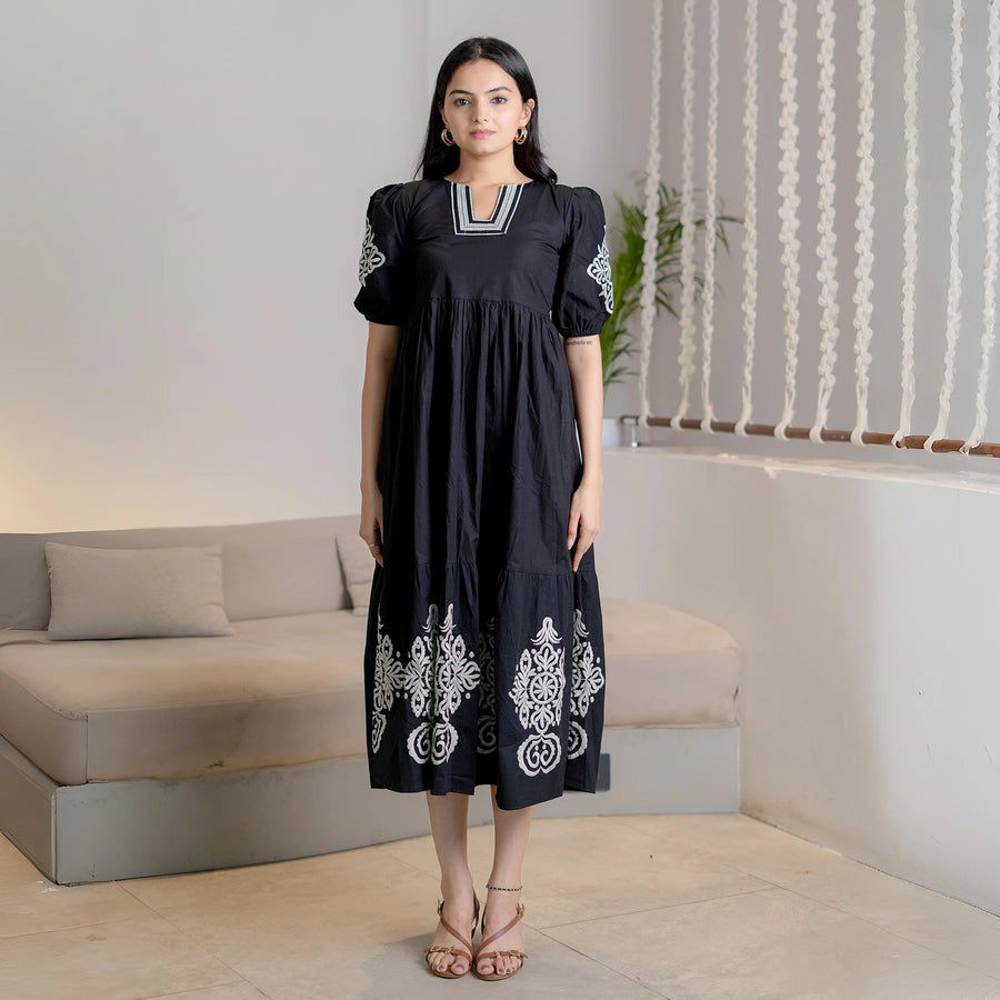 Noir Bloom black cotton maxi dress with white embroidery, a flared style perfect for festive or casual days