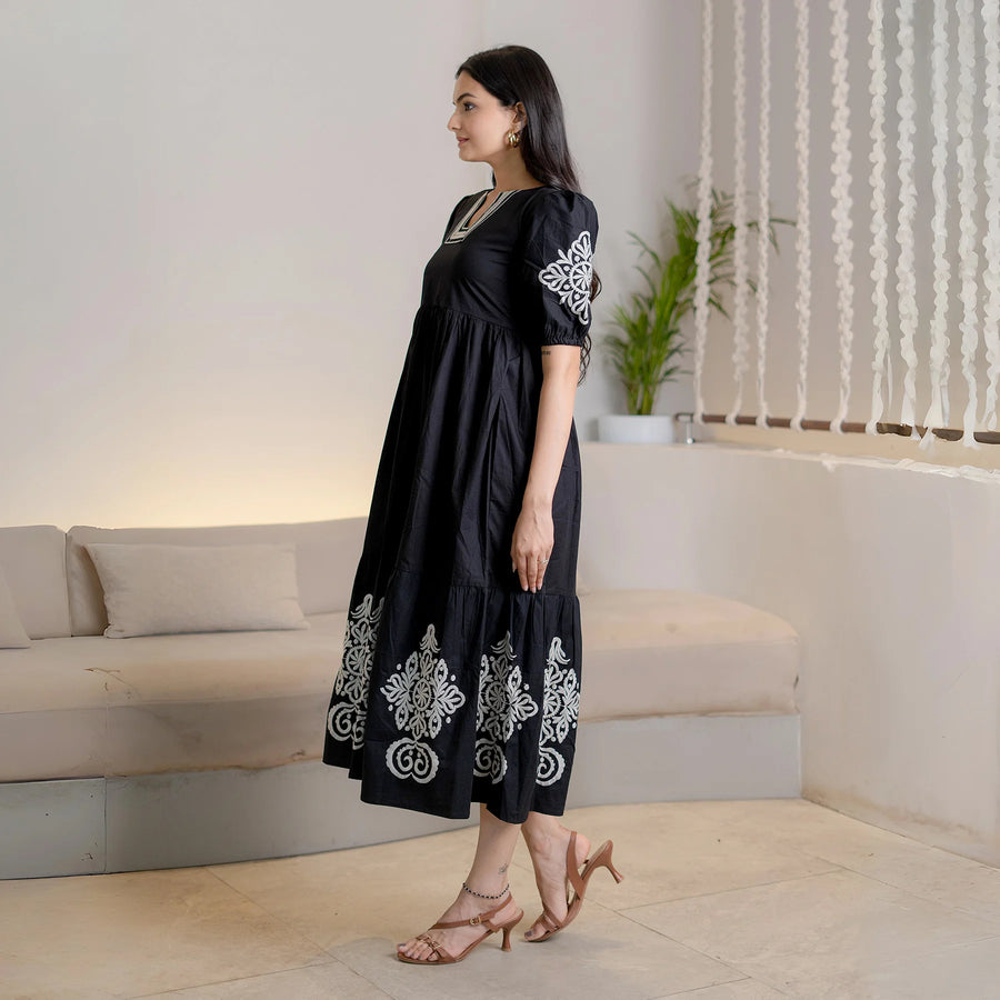 Noir Bloom black cotton long maxi dress features puff sleeves and a graceful drape from the side