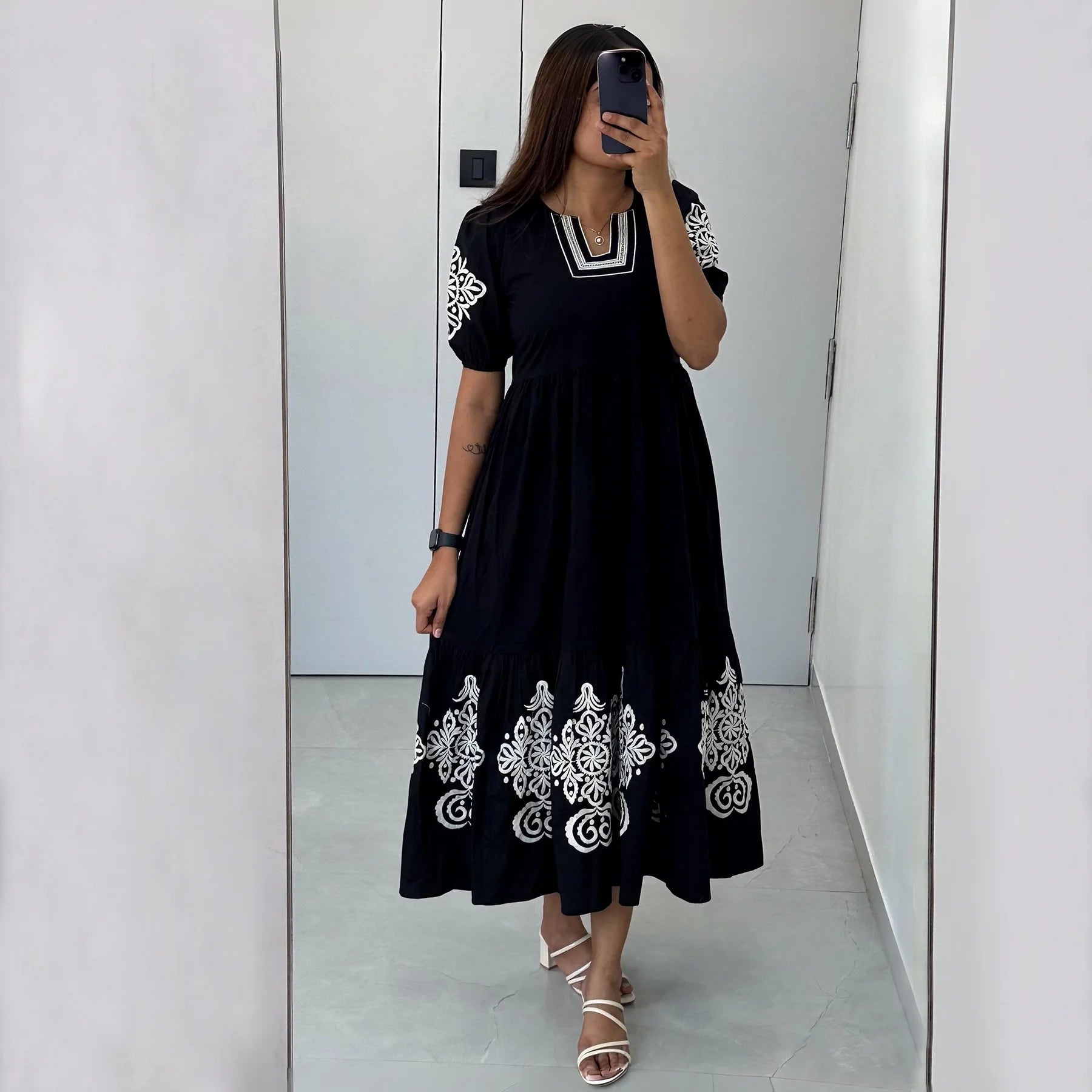 Mirror selfie of Noir Bloom black cotton maxi dress, a refined choice for casual gatherings
