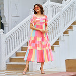 side pose of summer dresses for women in pastel pink color flowy fabric