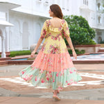 Back view of pastel floral midi dress for women – soft ruffle neckline and tiered design