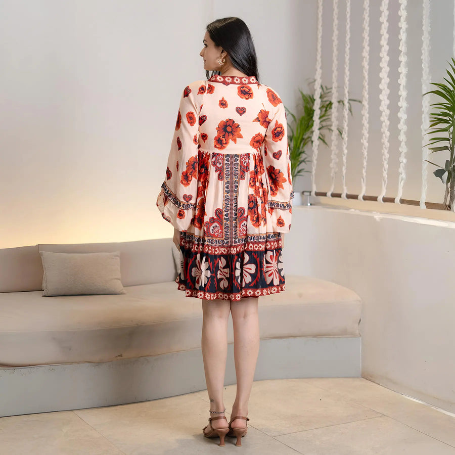 Model in back pose dressed in a floral frocks for women design, showing the natural flow and tiered flare of the dress