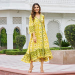 Twirling pose of yellow printed midi dresses for women – perfect Haldi function outfit in viscose