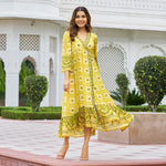 Yellow midi dress for women – walking pose, ideal as Haldi ceremony dress or beach vacation wear