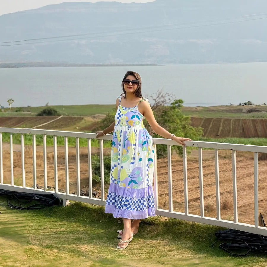 Tropical Breeze sleeveless long maxi dress styled by influencer outdoors, ideal for beach outings and resort stays