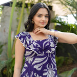 Close-up shot of woman in Twilight Bloom floral maxi dress, highlighting lightweight fabric.
