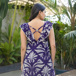 Back view of Twilight Bloom flowy floral maxi dress, showing delicate strap details.