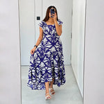 Woman capturing mirror photo in Twilight Bloom maxi dress, ideal for vacations and brunches.