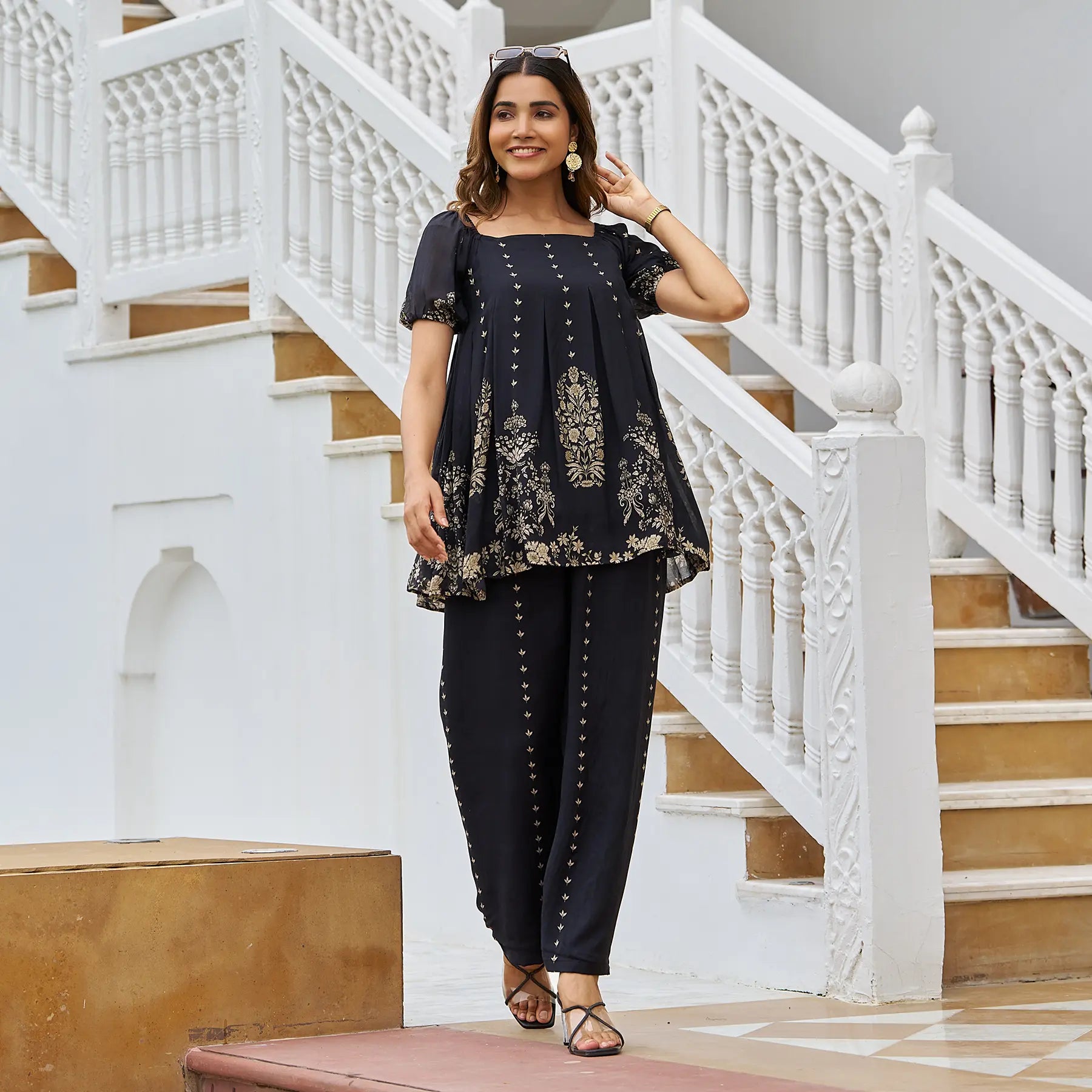Woman walking in black co ord set for women, perfect for festive events and Diwali celebrations.