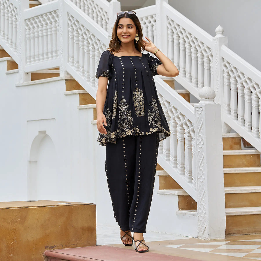 Woman walking in black co ord set for women, perfect for festive events and Diwali celebrations.