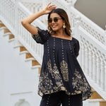 Close-up of black printed co ord dress top with square neckline and ethnic details for festive days.
